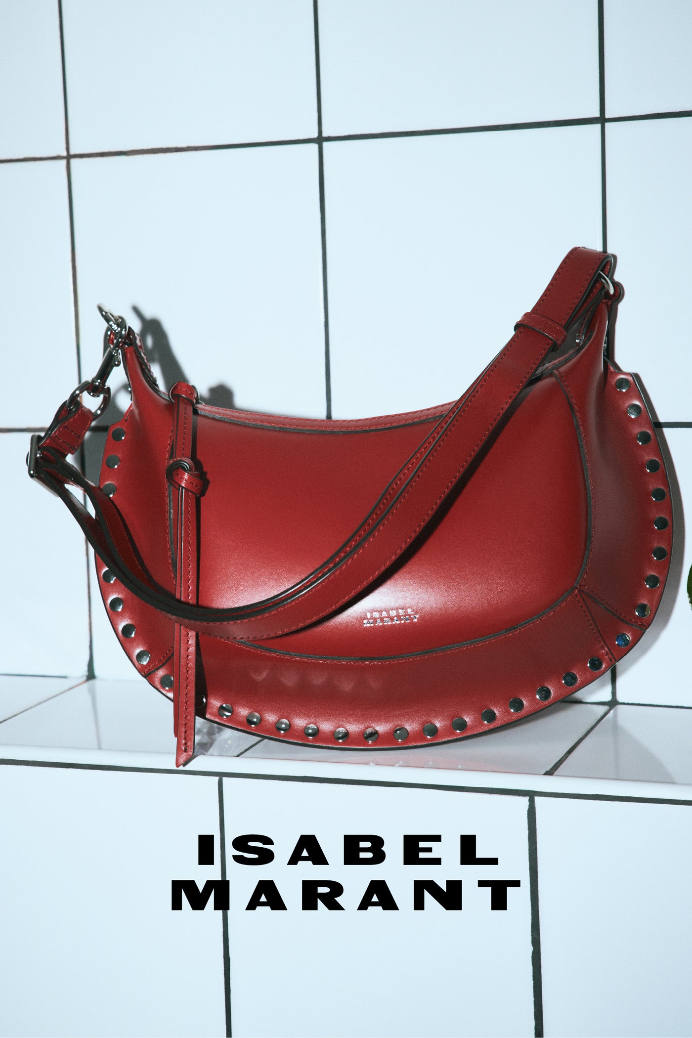 Red oskan moon bag on white wall